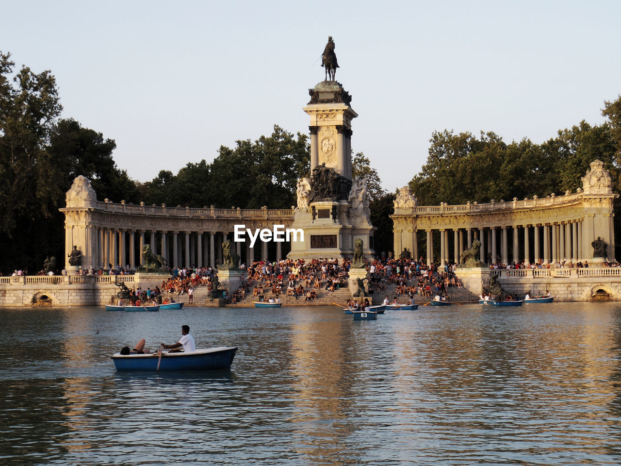 People at monument of alfonso xii in buen retiro park
