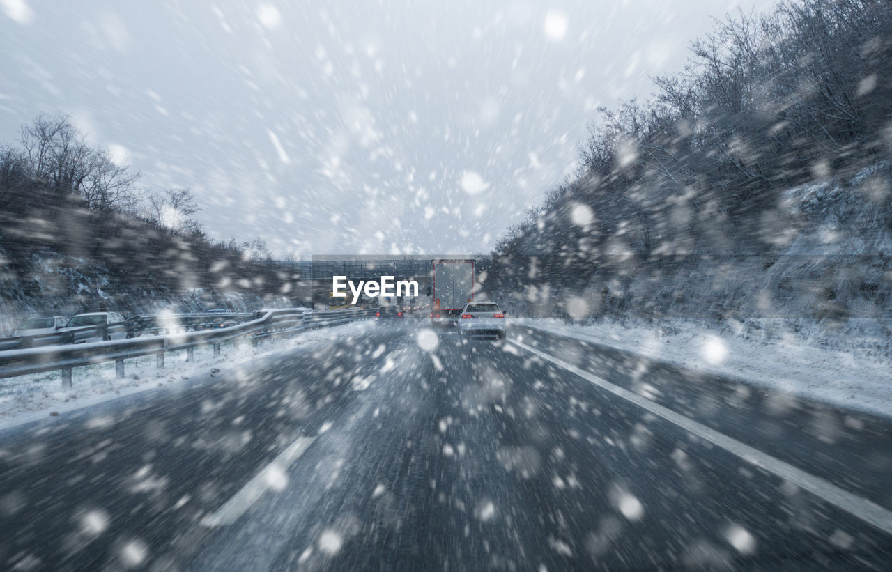 CARS ON ROAD IN WINTER