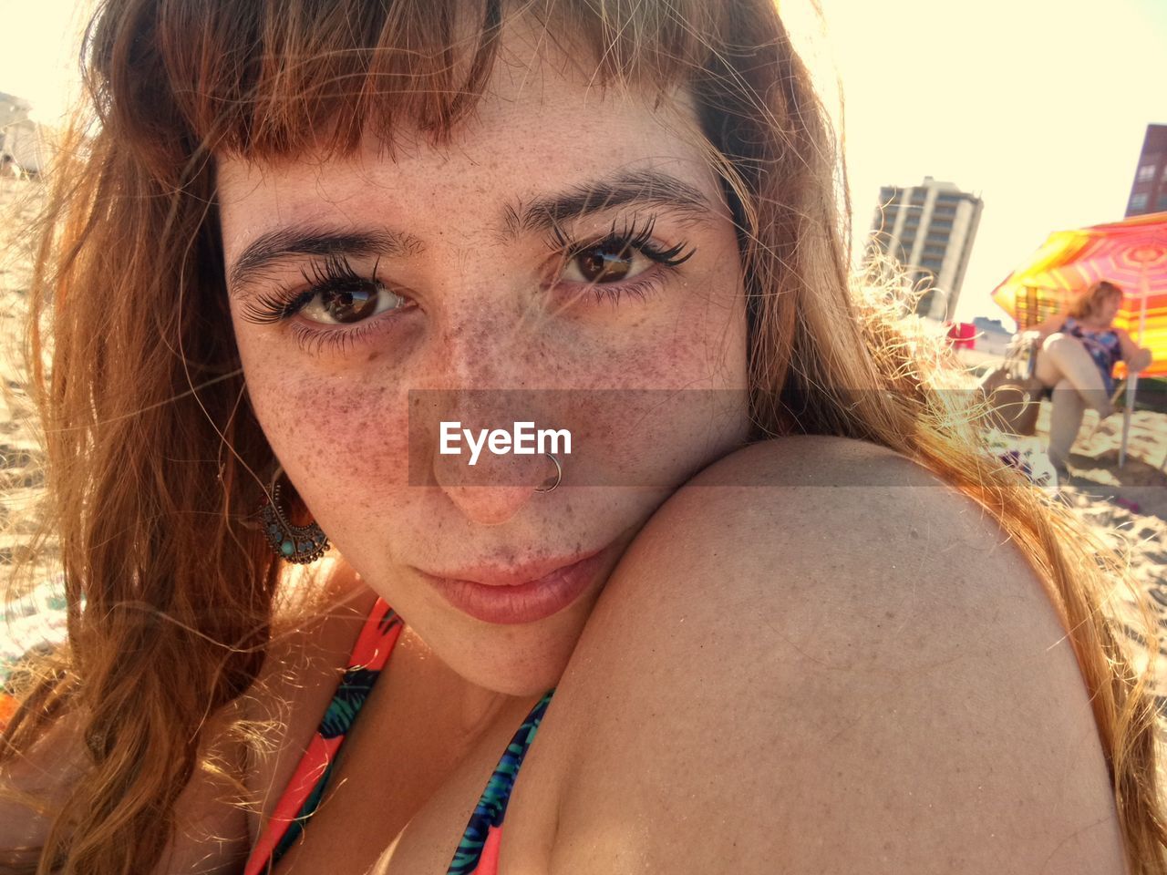 Close-up portrait of woman at beach