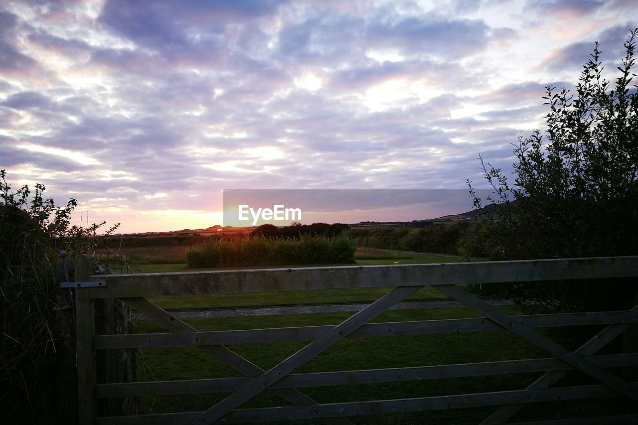 VIEW OF LANDSCAPE AGAINST SKY DURING SUNSET