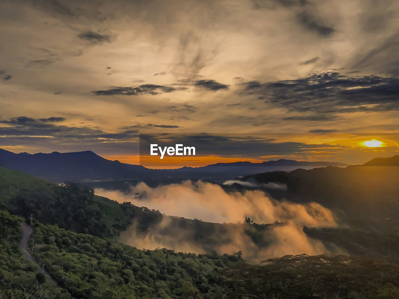 Scenic view of mountains against sky during sunset