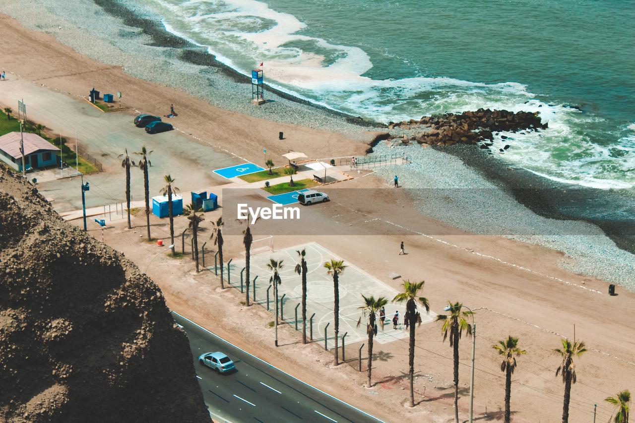 HIGH ANGLE VIEW OF BEACH BY SEA