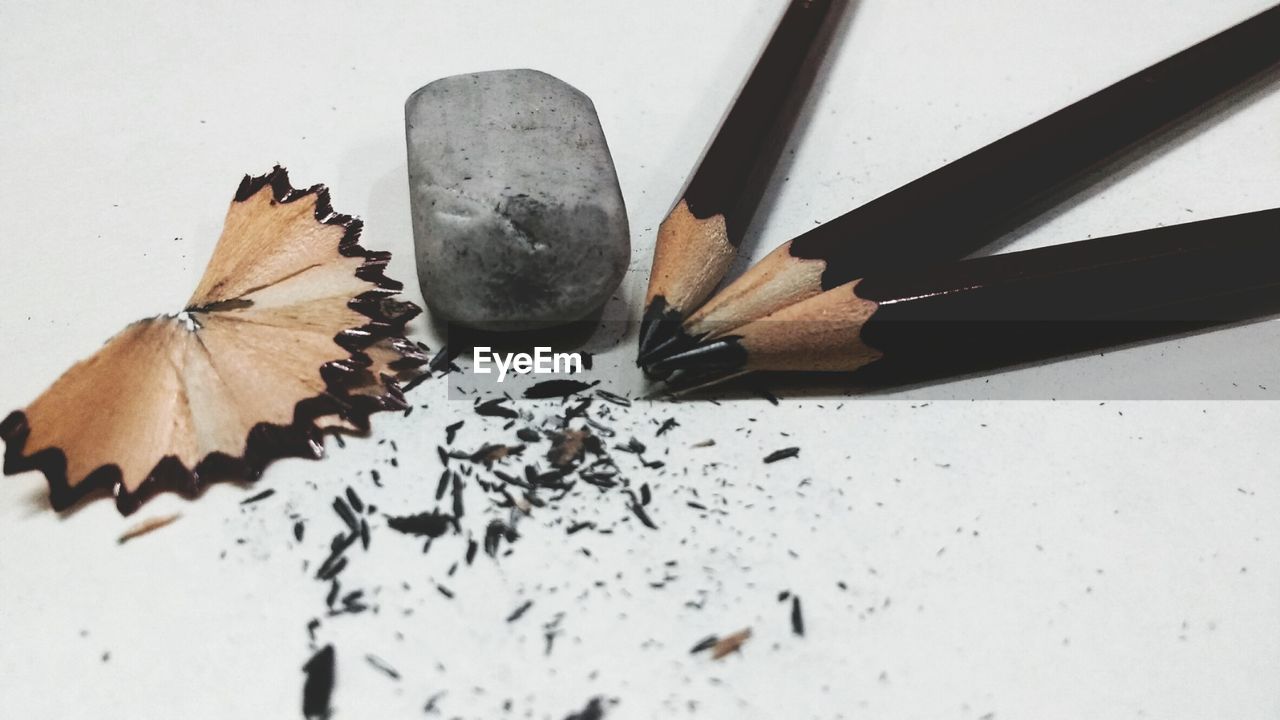 High angle view of pencils and eraser on gray background