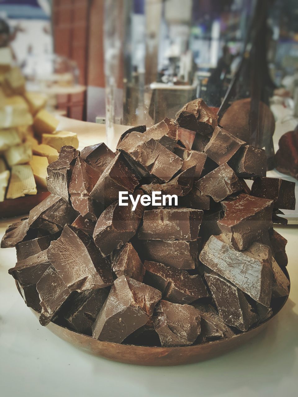 Stacked chocolates in plate at store for sale