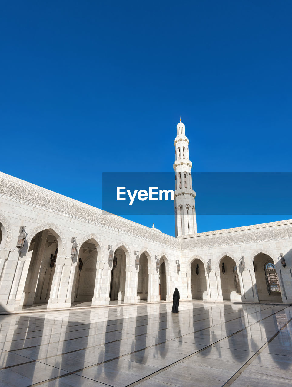 Low angle view of building against clear blue sky