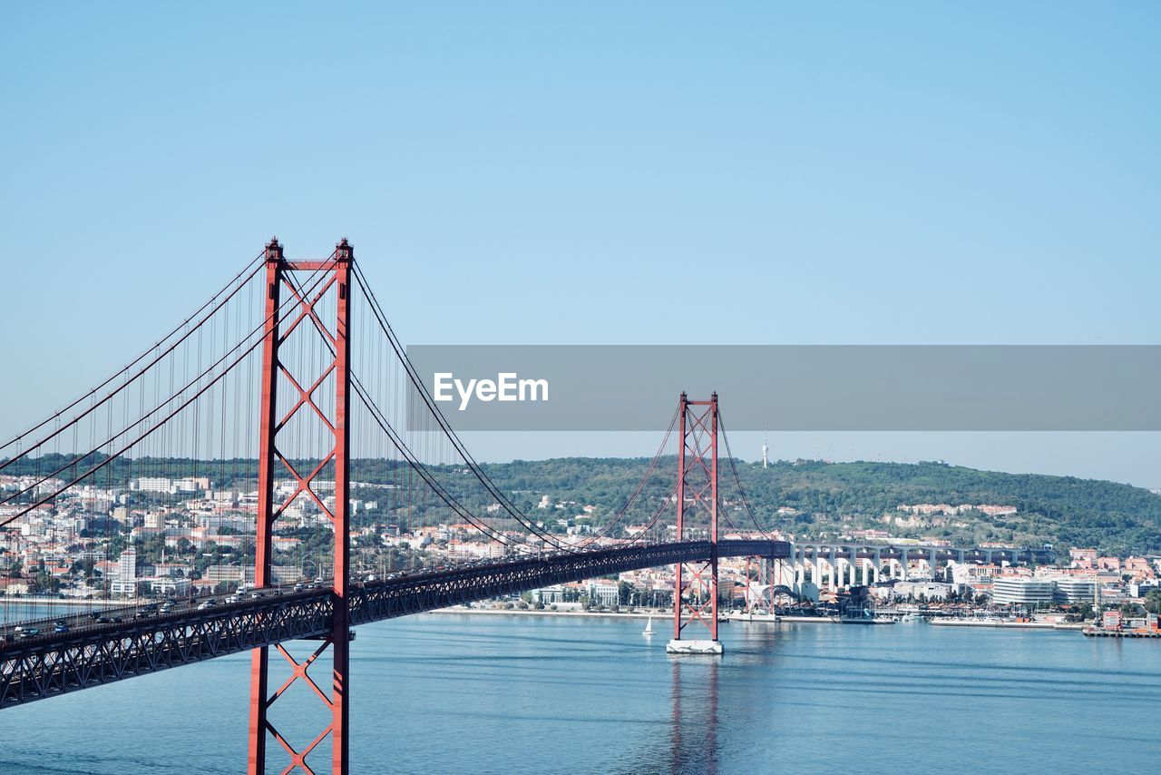 View of the tagus river in lisbon with the bridge of the ponte 25 de abril, lisbon portugal