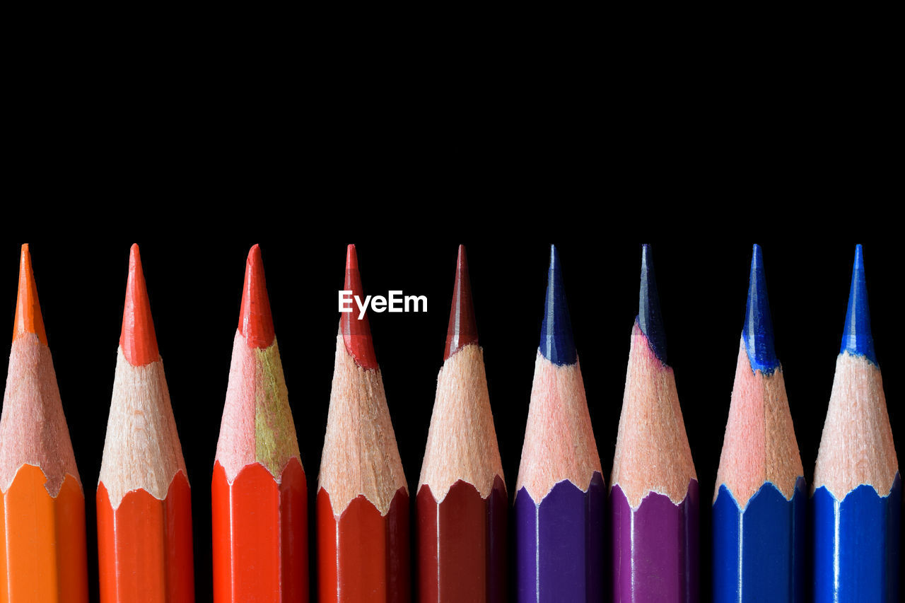 pencil, multi colored, colored pencil, variation, in a row, large group of objects, no people, writing instrument, close-up, indoors, studio shot, creativity, still life, office supplies, sharp, craft, order, side by side, black background, red, arrangement, education, wood, blue, group of objects