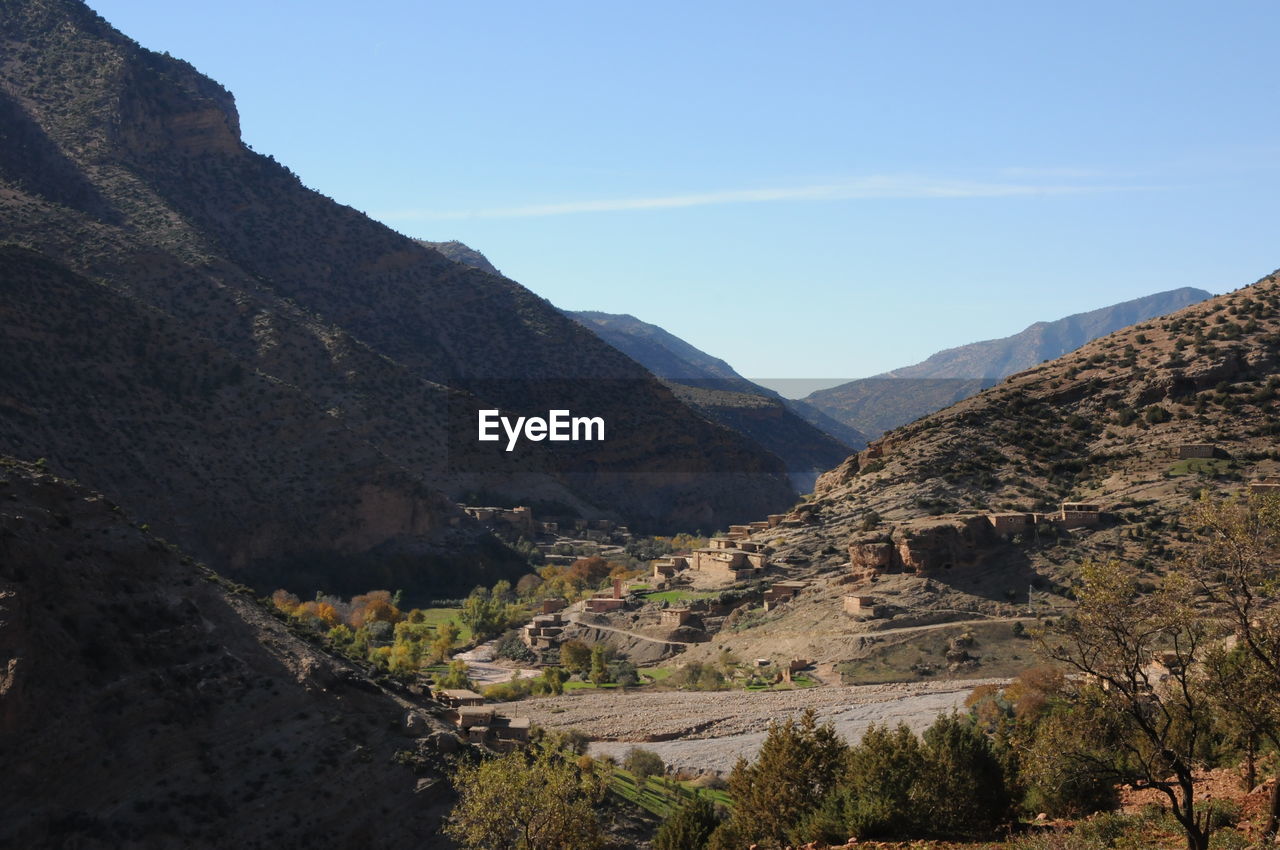 Scenic view of mountains against clear blue sky