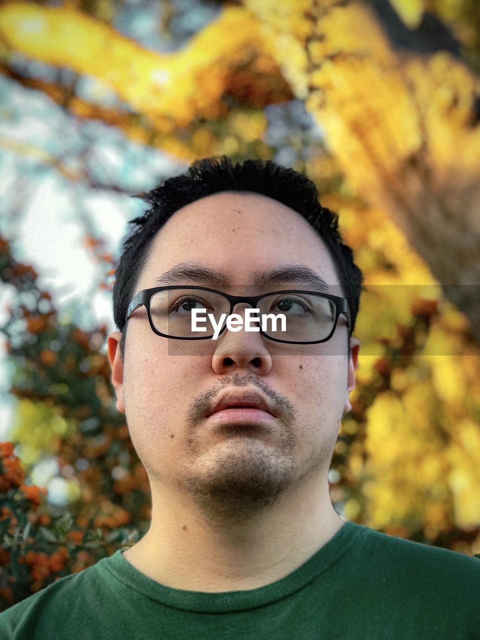 PORTRAIT OF YOUNG MAN WITH EYEGLASSES