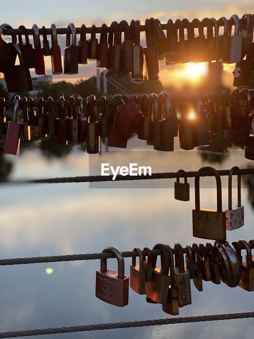 CLOSE-UP OF PADLOCKS ON RAILING