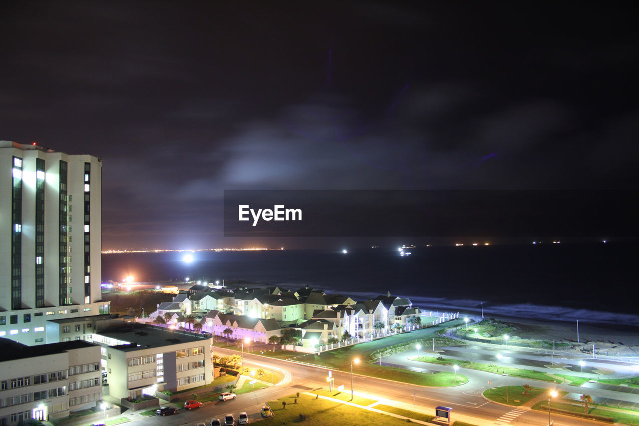 HIGH ANGLE VIEW OF ILLUMINATED CITYSCAPE