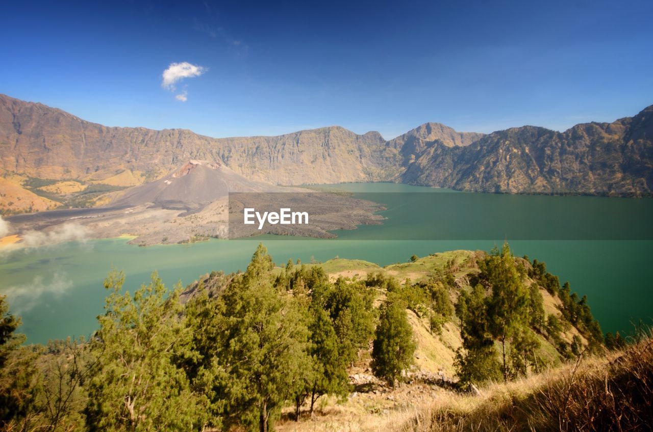 Scenic view of landscape and mountains against sky