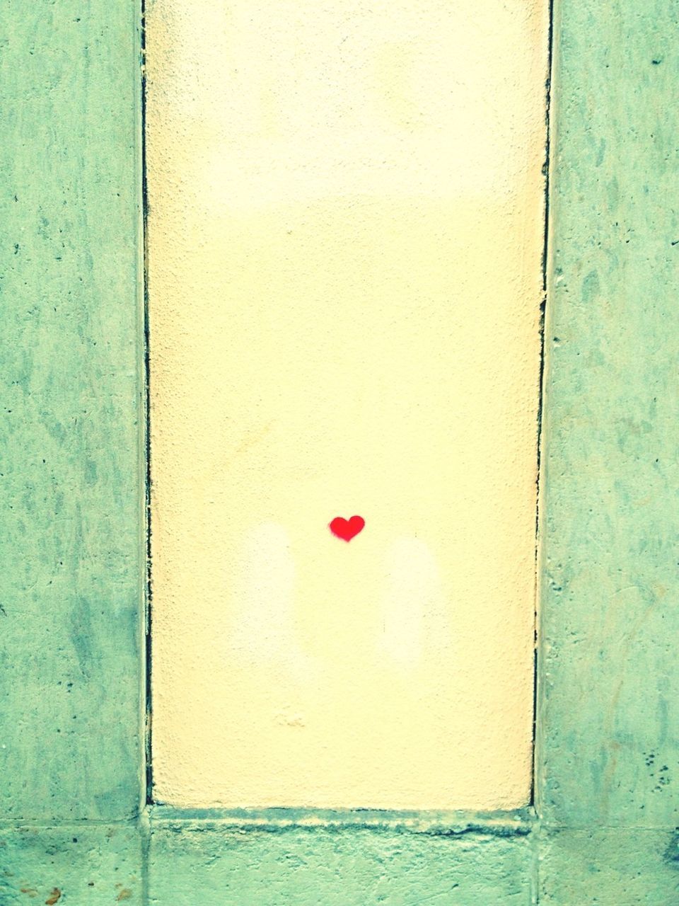 Little red heart on wall