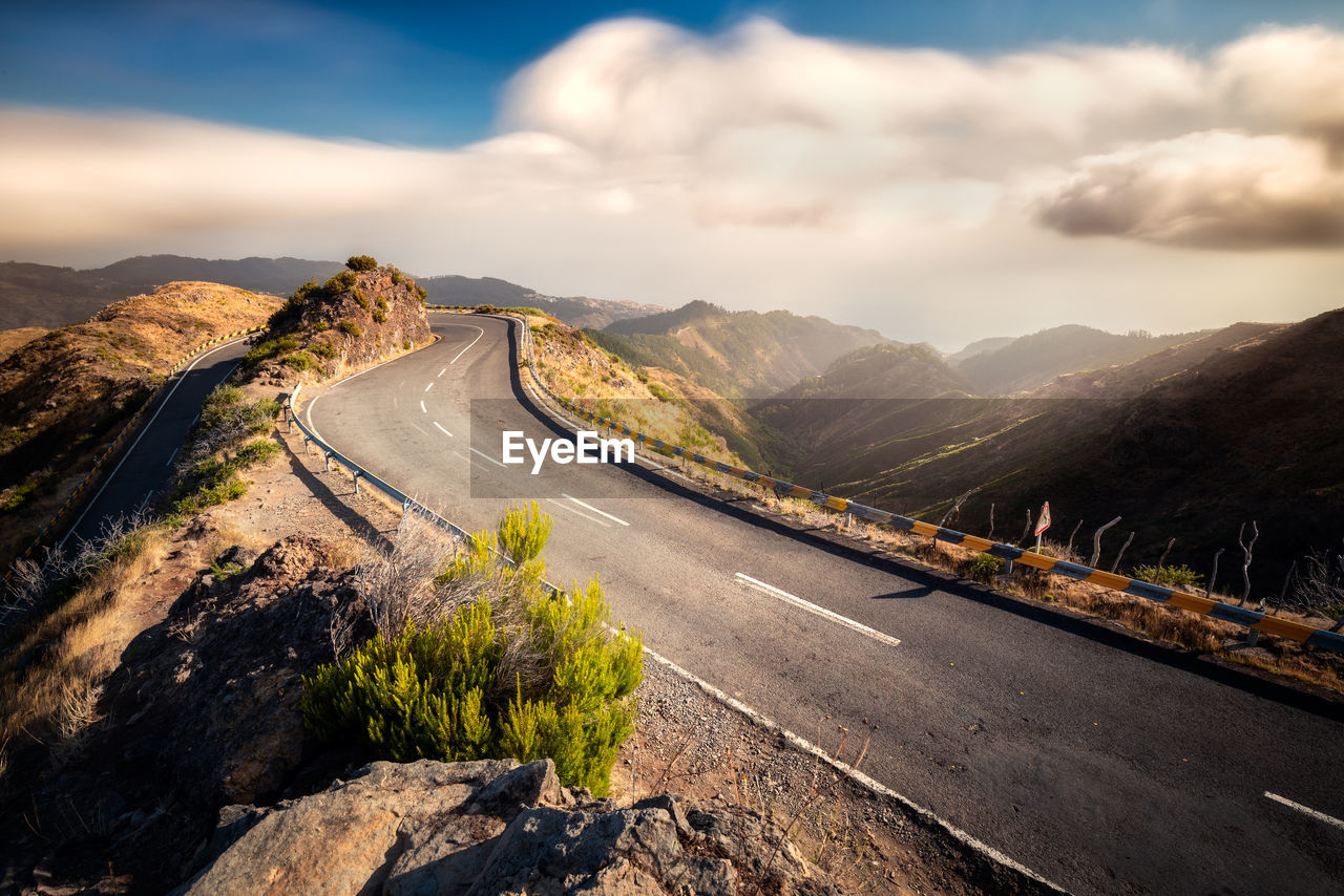 Scenic view of mountain road against sky