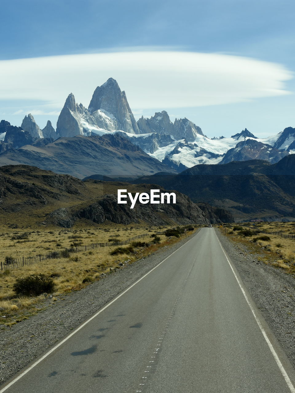 Road amidst mountains against sky