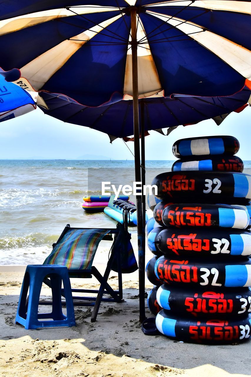 LOUNGE CHAIRS ON BEACH