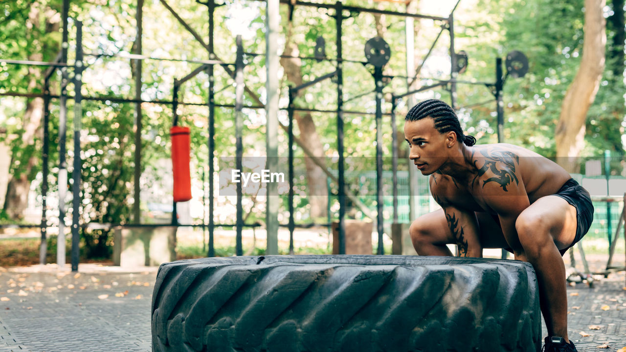 High angle view of man exercising on street in city