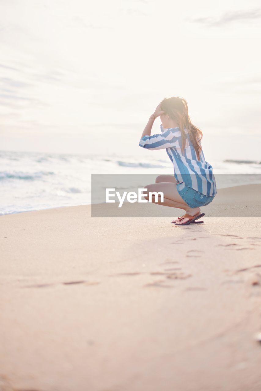 Side view of woman at beach