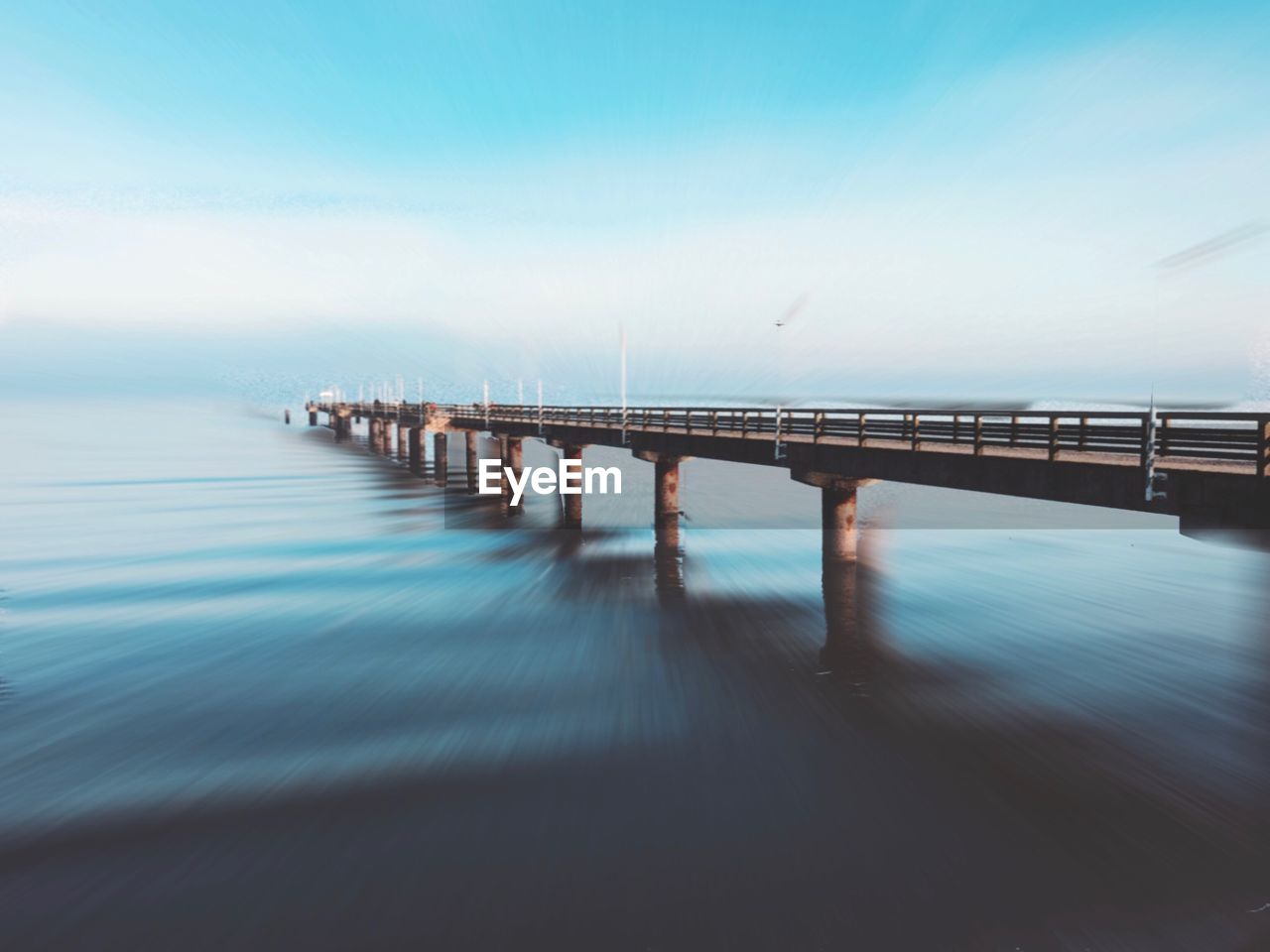 Pier over sea against sky