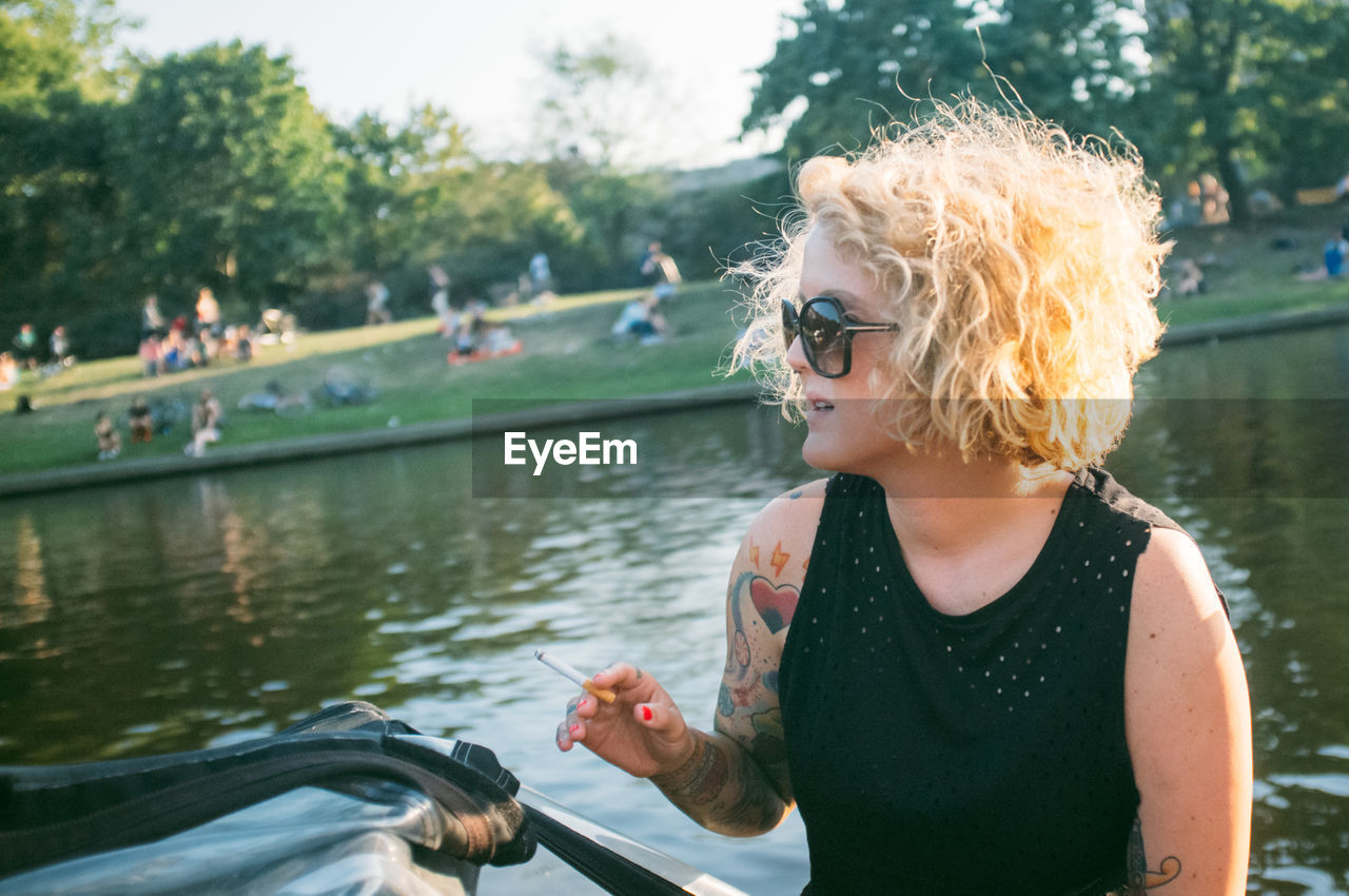 Women sitting and enjoying in boat at river