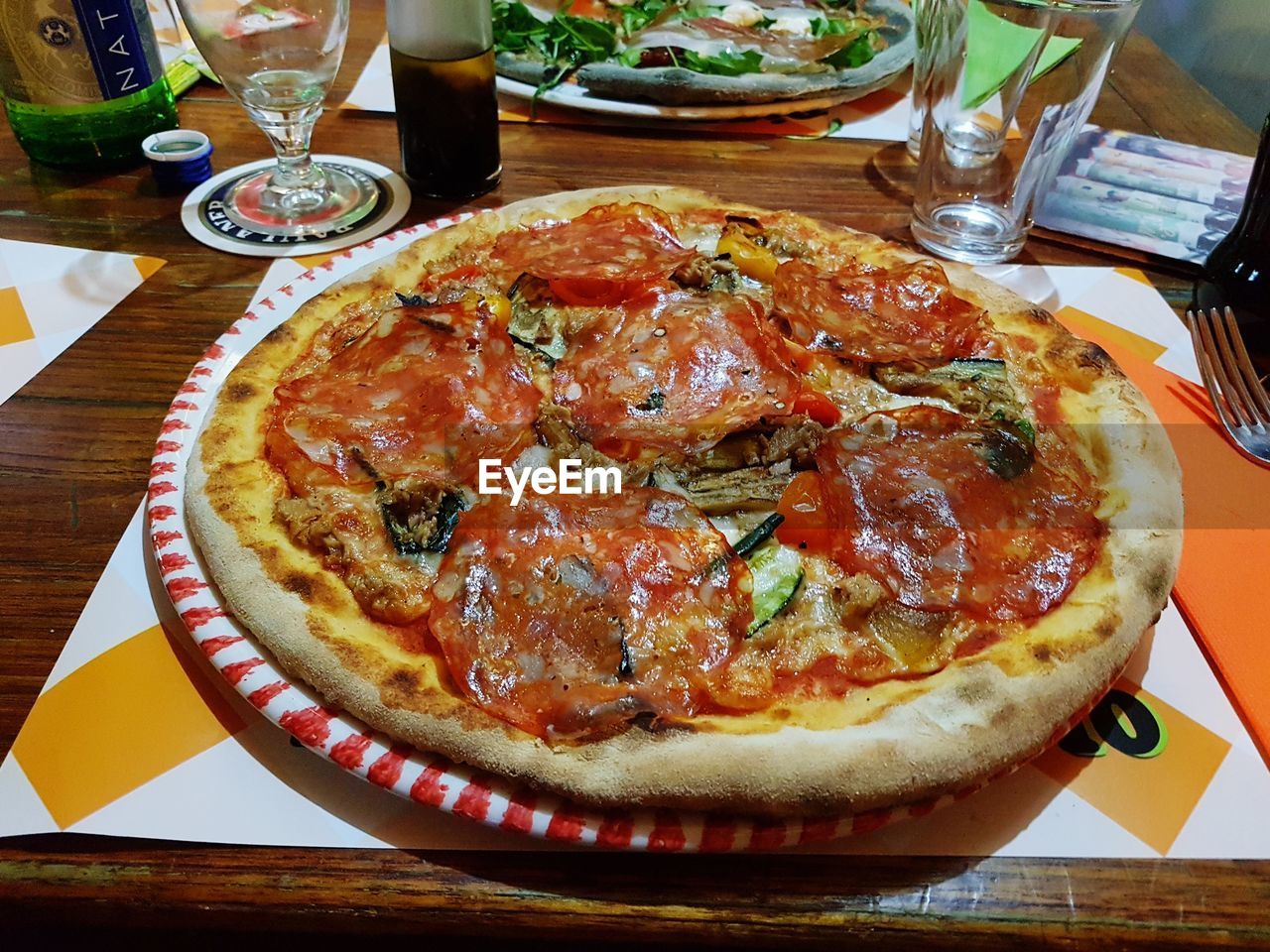 CLOSE-UP OF PIZZA SERVED ON PLATE