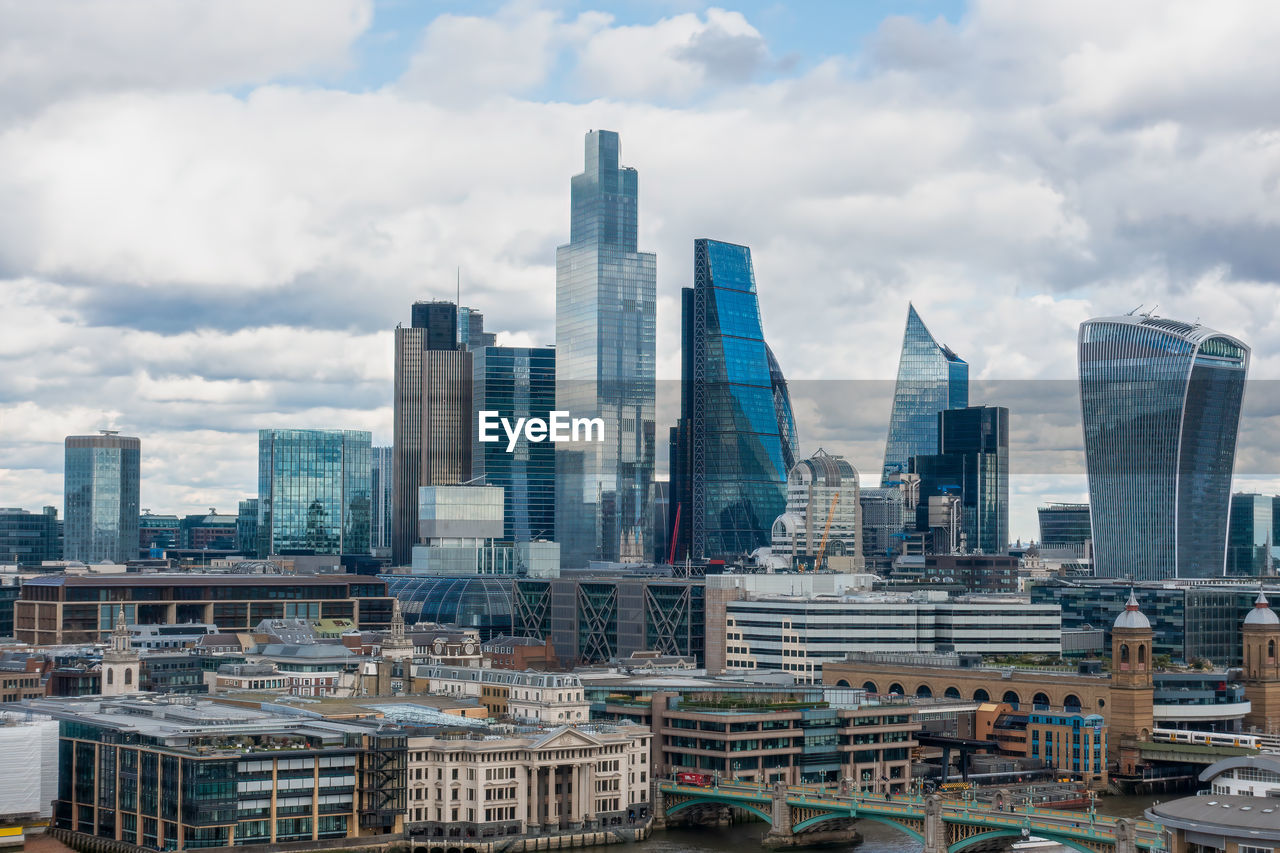 Modern buildings in city against sky