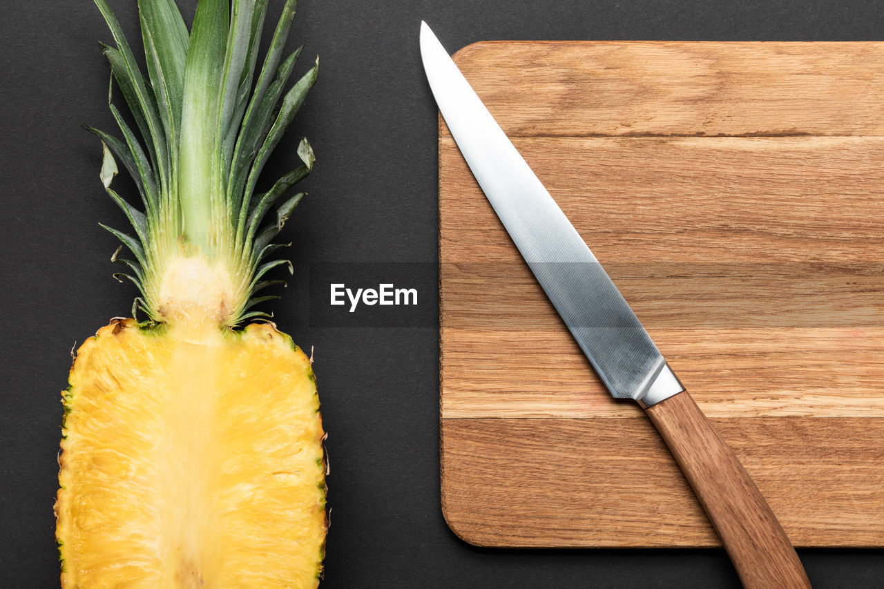 directly above shot of pineapple on cutting board