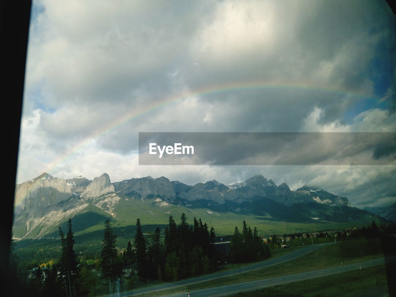 Scenic view of mountains against cloudy sky