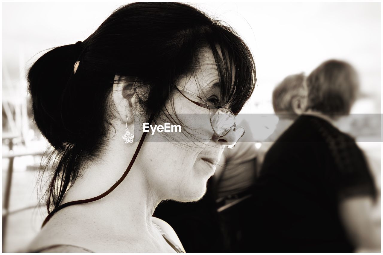 Side view of woman wearing eyeglasses