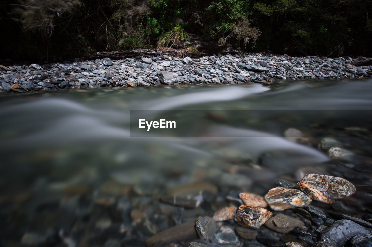 Close-up of water flowing through rocks