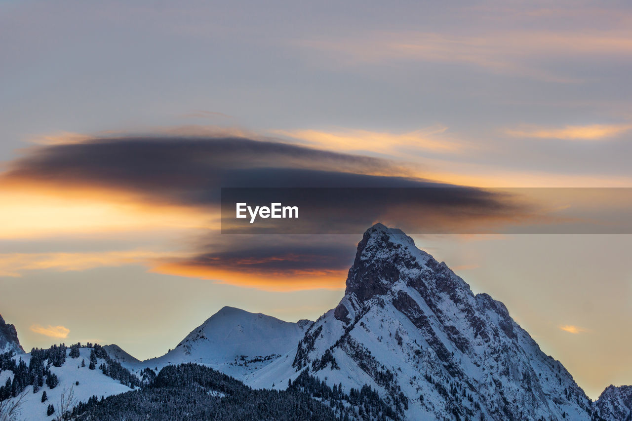 Scenic view of mountains against sky during sunset