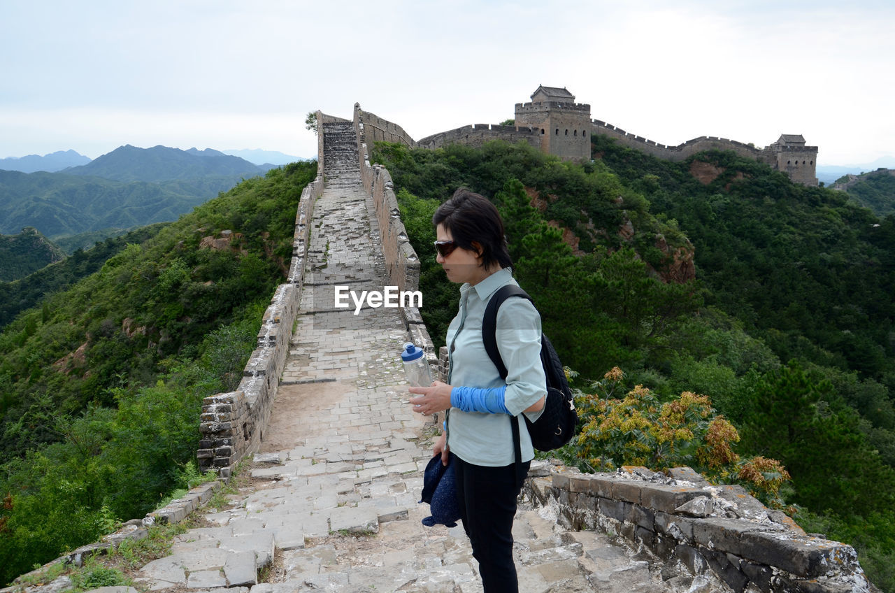 High angle view of a woman standing on great wall of china