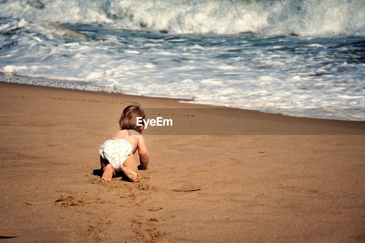 Baby boy on beach