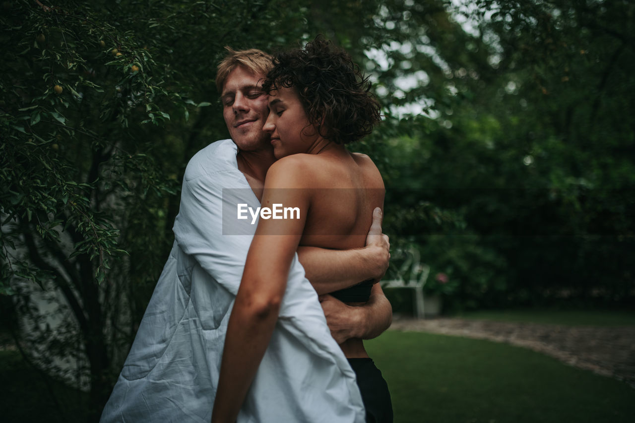 Happy couple standing outdoors