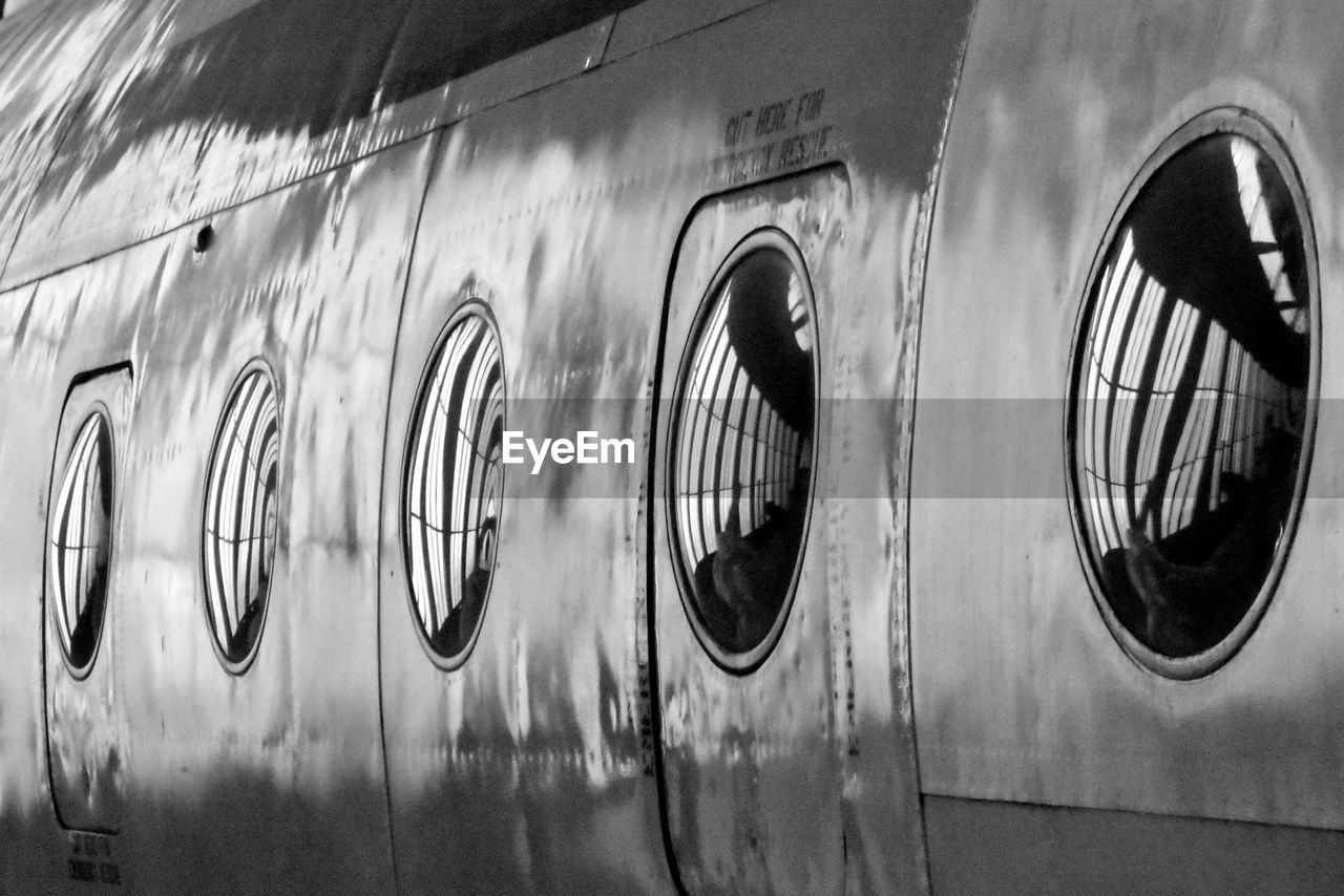 black and white, monochrome, black, white, monochrome photography, no people, wall - building feature, vehicle, day, close-up, metal, architecture, indoors