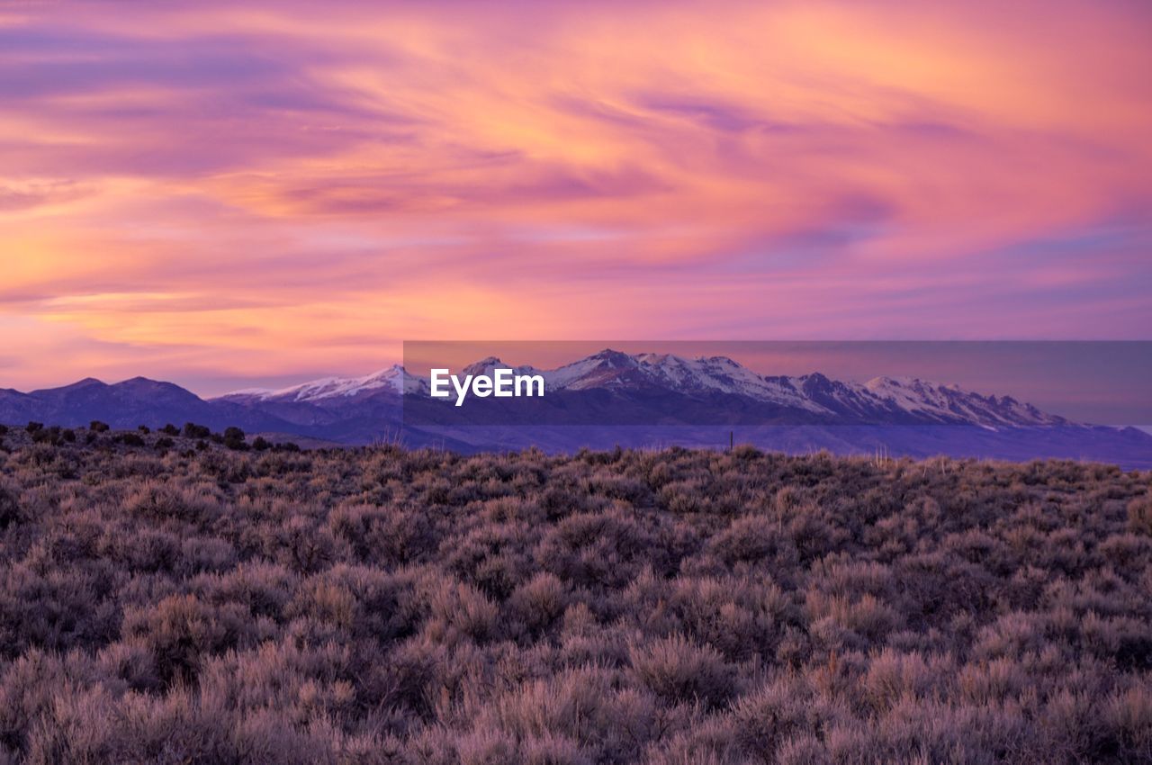 Scenic view of mountains against sky during sunset