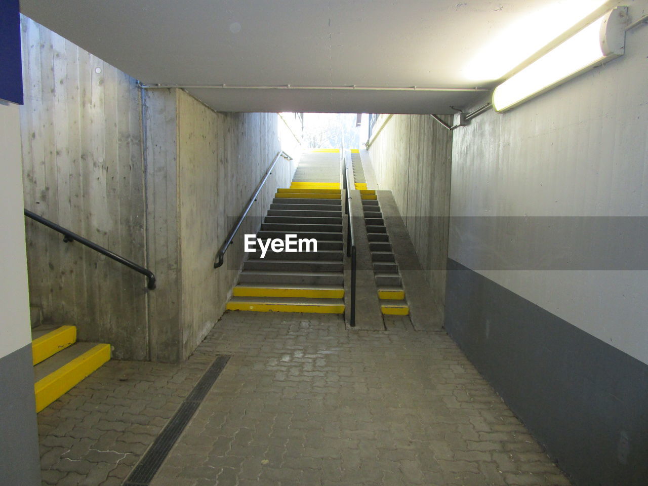 STEPS IN ILLUMINATED CORRIDOR