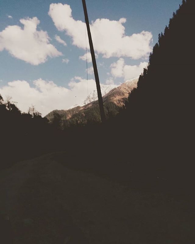 CLOUDY SKY OVER MOUNTAIN RANGE