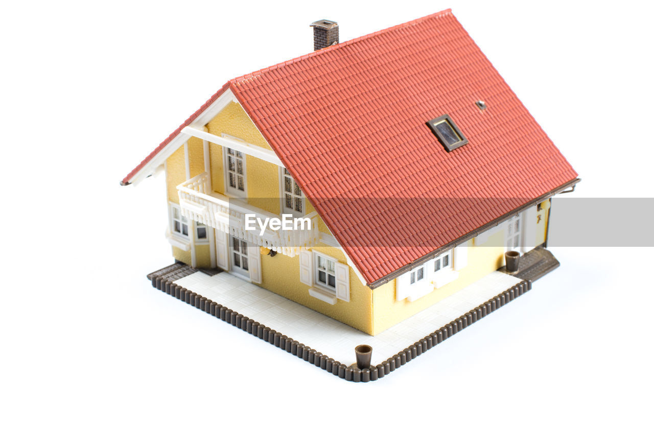 Model house in front of a white background