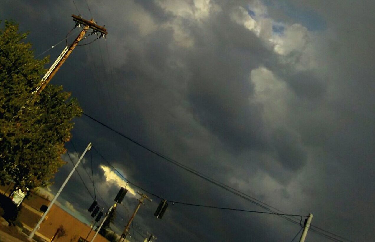 LOW ANGLE VIEW OF ELECTRICITY PYLON AGAINST CLOUDY SKY