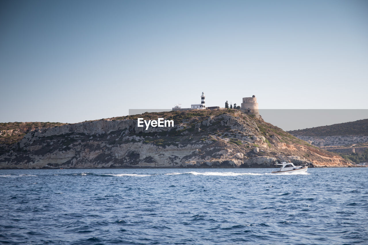 View of calamosca hill and its tower and lighthouse. cagliari, sardinia, italy