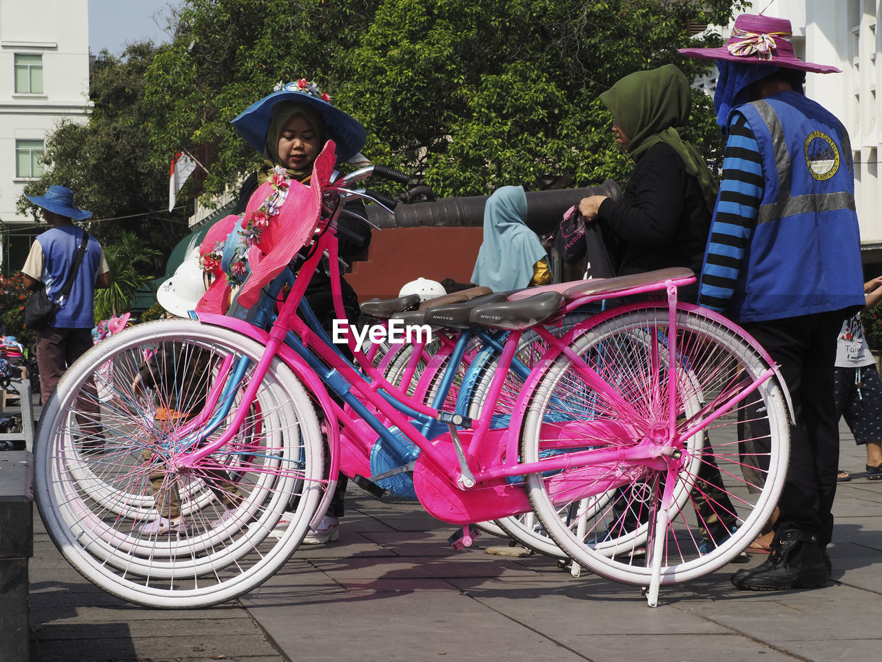 PEOPLE RIDING BICYCLES ON STREET