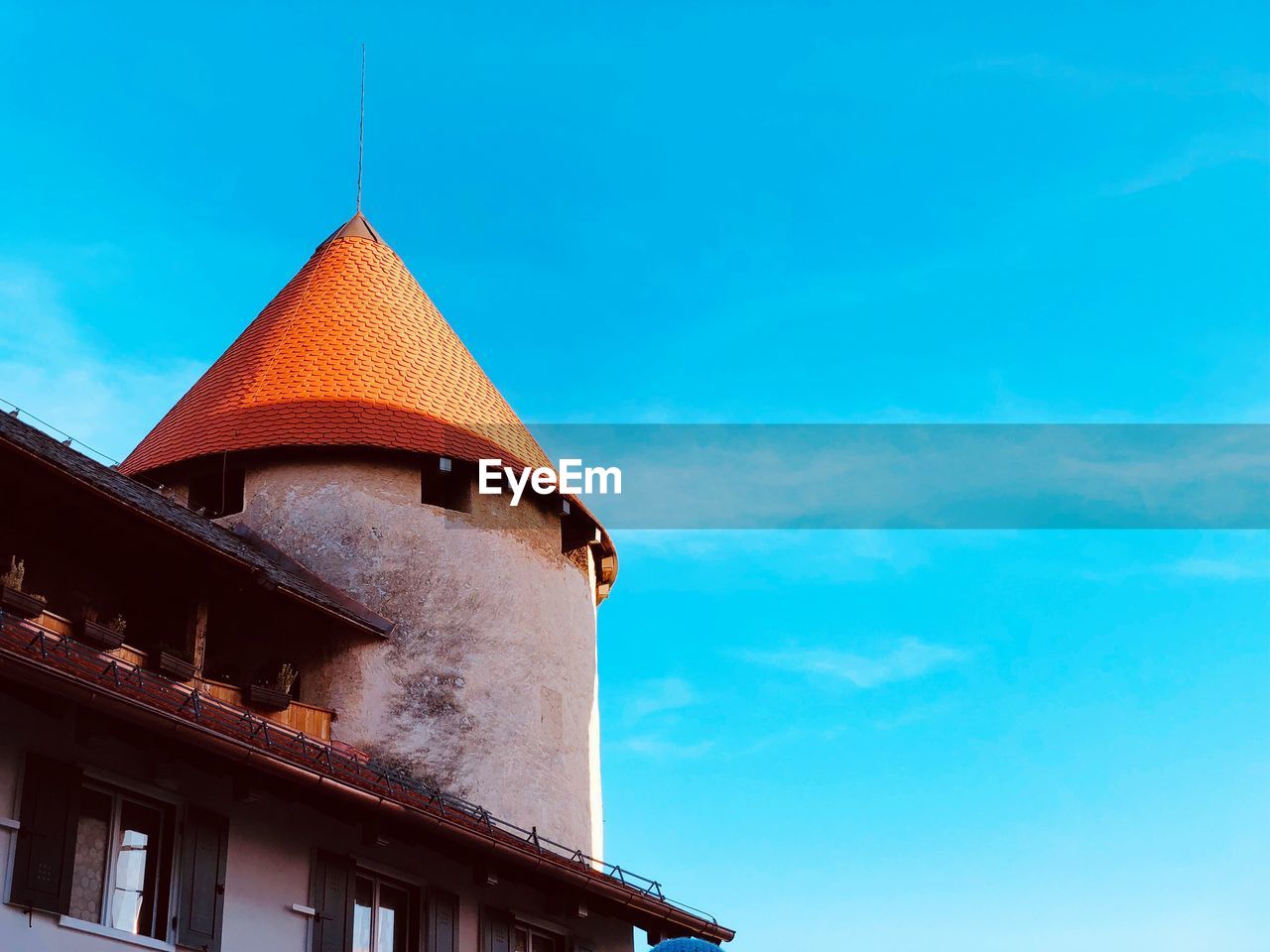 Low angle view of church against blue sky at slovenia in europe 