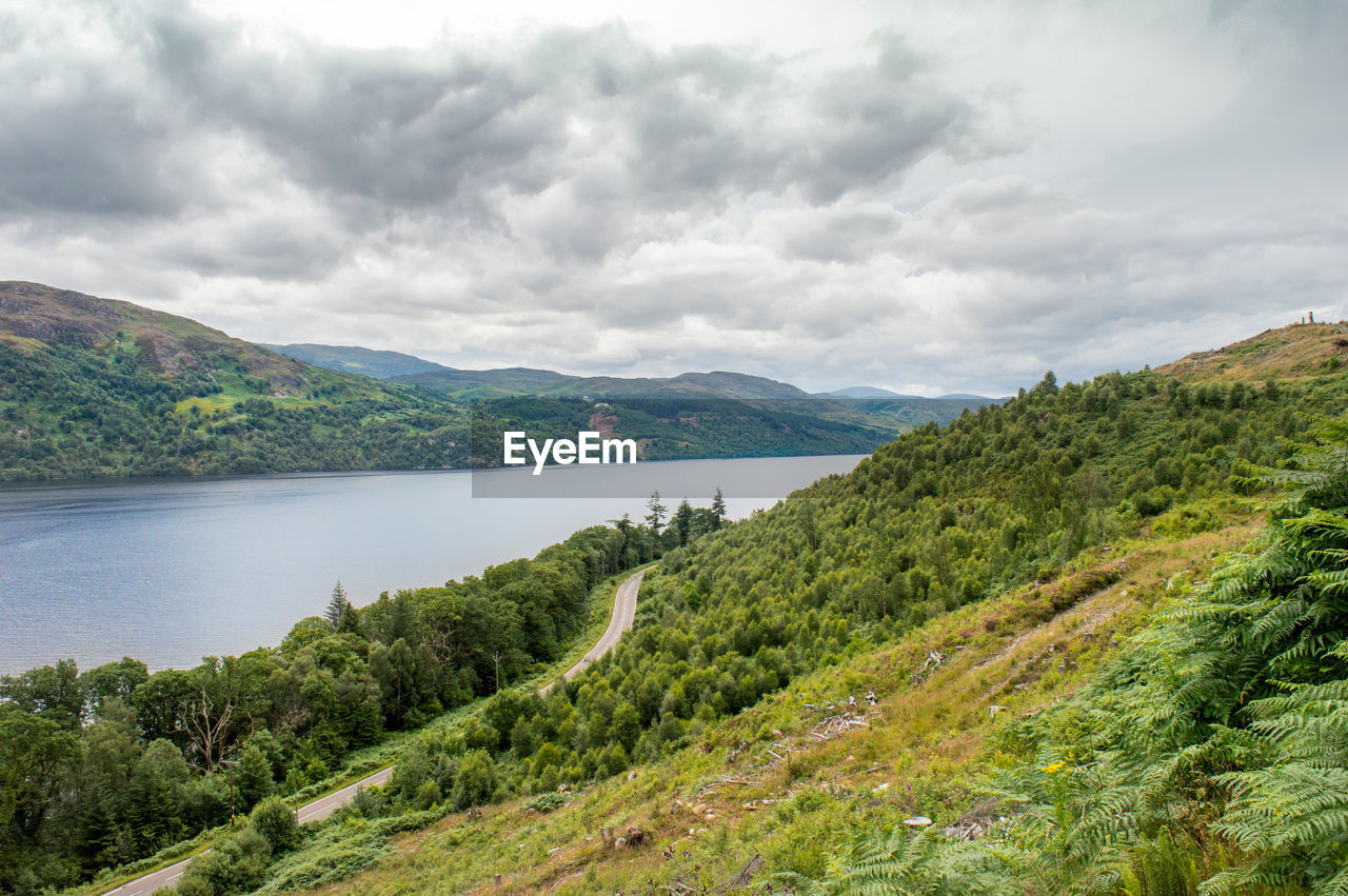 Scenic view of landscape and mountains against sky