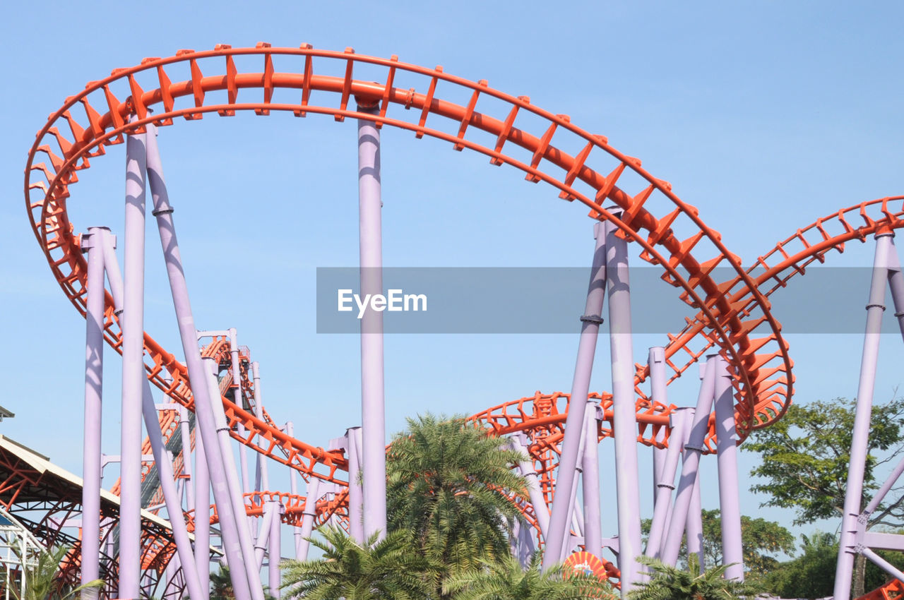 Low angle view of rollercoaster against sky