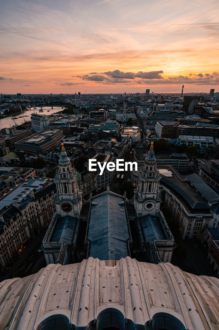 High angle view of city against sky during sunset