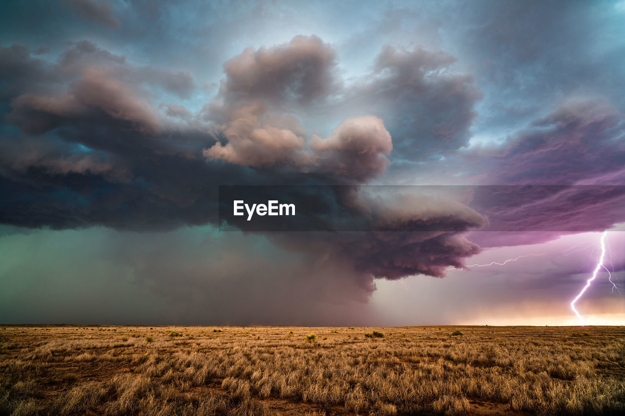 Lightning strikes from a supercell thunderstorm near roswell, new mexico.