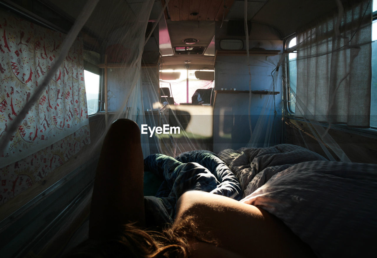 Young woman lying in motor home