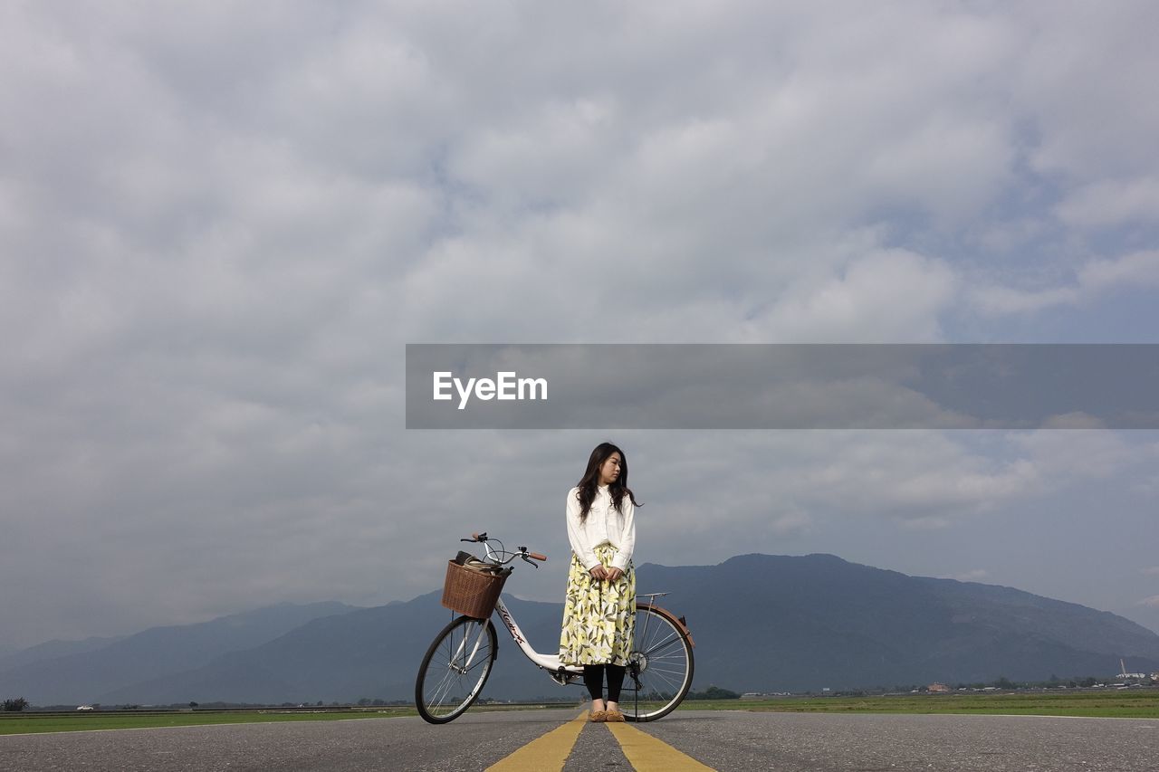 MOTORCYCLE ON ROAD AGAINST SKY