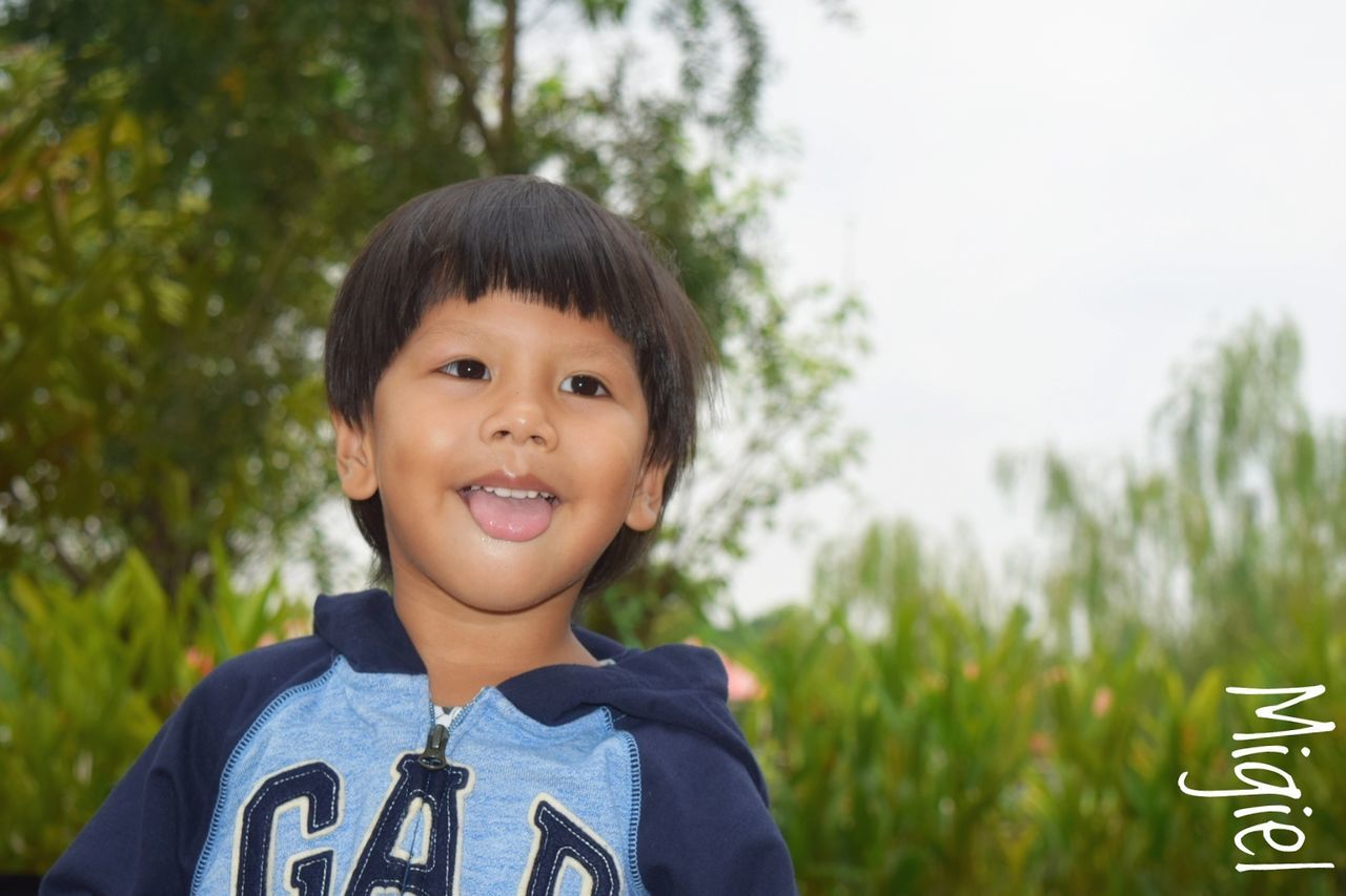 CLOSE-UP PORTRAIT OF SMILING BOY